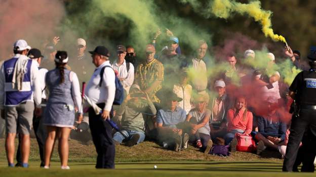  Women’s Open: Protesters with flares halt play after making way on to 17th green